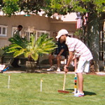 Finals of the Adult/Child Champion bracket, played at the historic Lanterman House: Adel Kamal runs two wickets on one shot while his father Mohammad Kamal watches.
