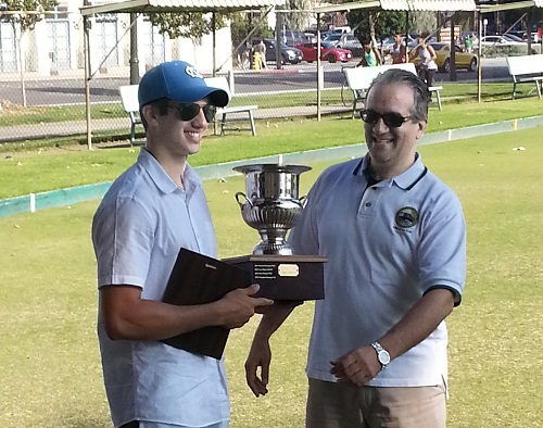 Adel Kamal accepts the Cup from his father, Dr. Kamal. | Photo by Michael Rumbin